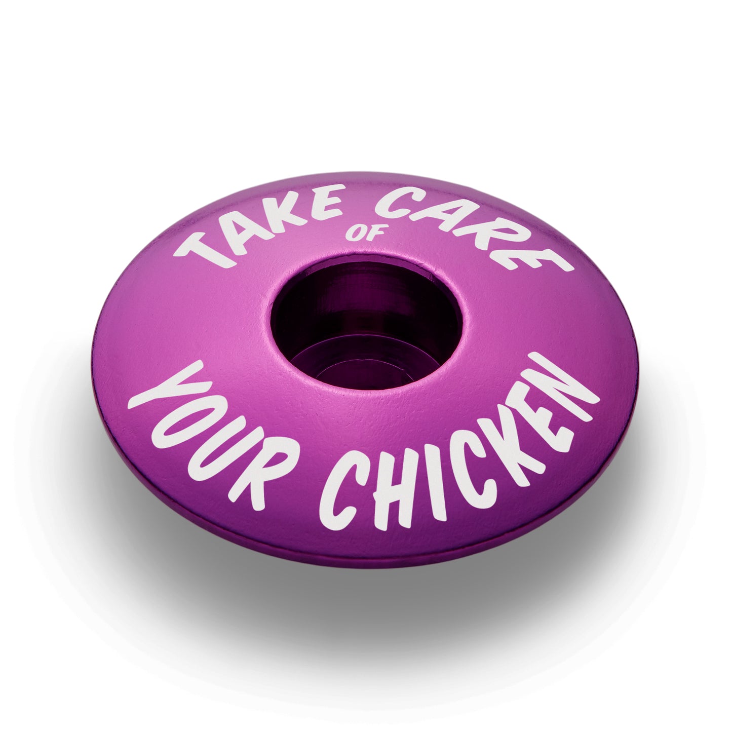 Purple bicycle headset cap for 1 1/8 inch steerer tubes made from durable aluminum for bike customization.