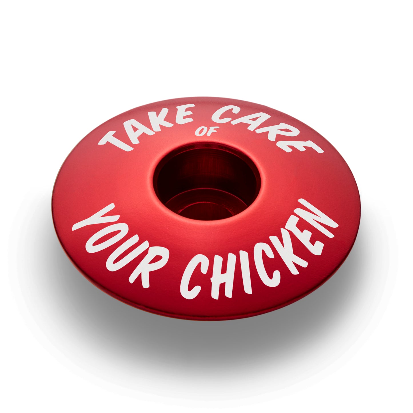 Red bicycle headset cap for 1 1/8 inch steerer tubes made from durable aluminum for bike customization.