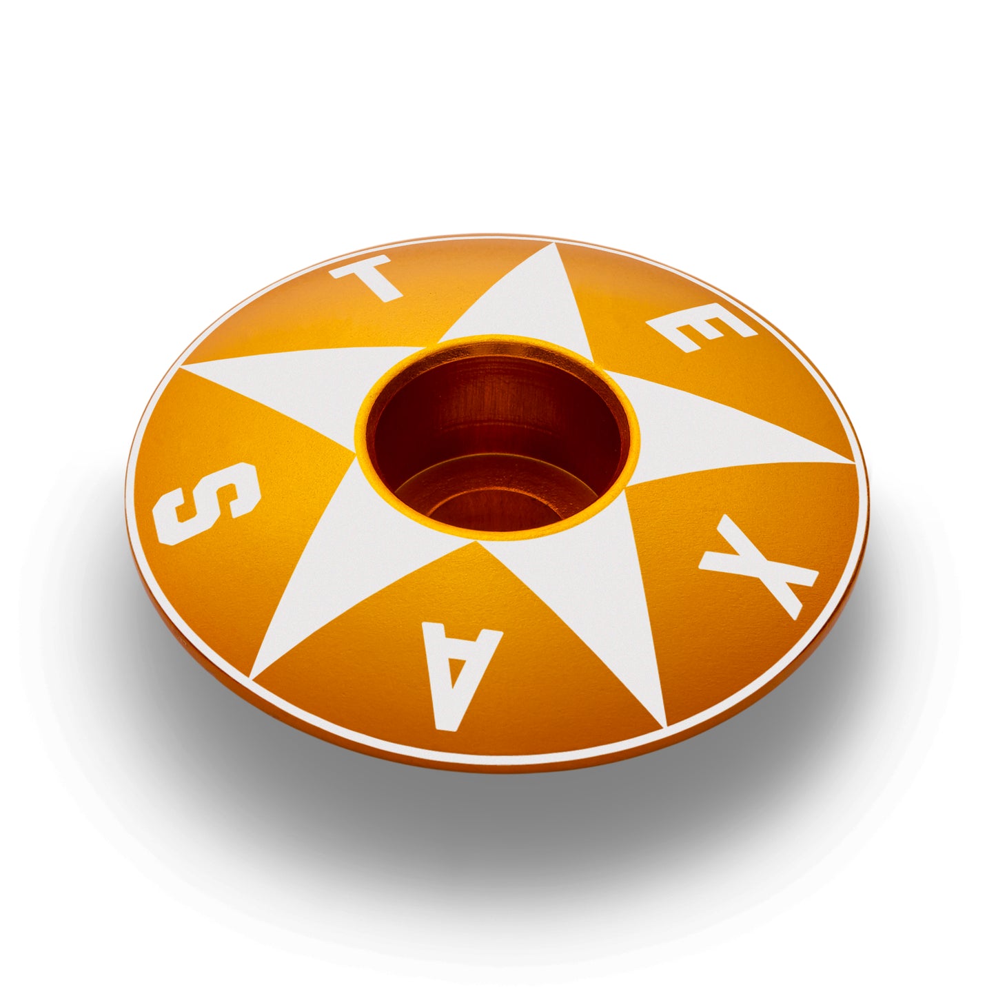 Gold Texas top cap with a star design surrounded by Texas lettering.