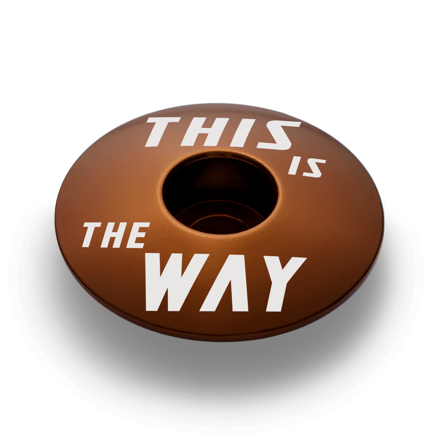 Brown bike headset cap for 1 1/8" steerer tubes durable and lightweight aluminum design.