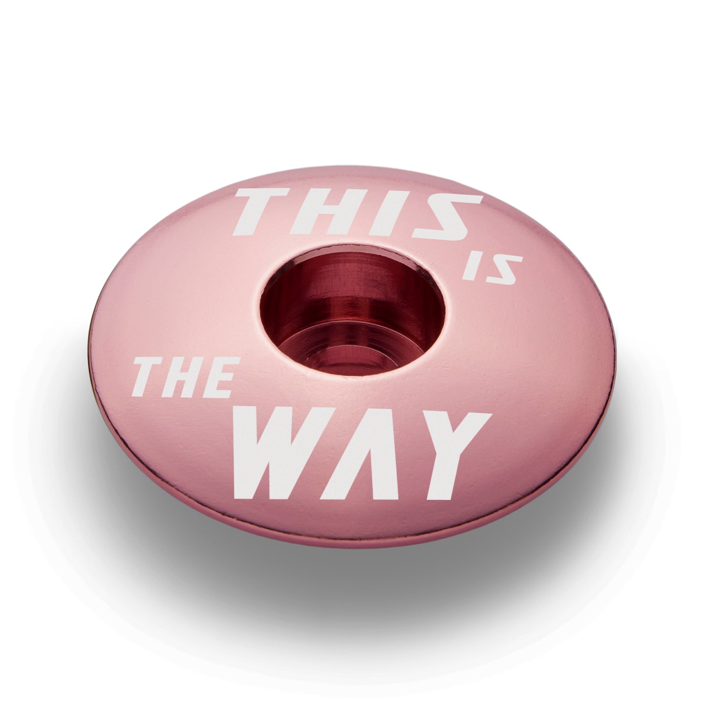 The pink stem top cap is lightweight and durable for 1 1/8" steerer tubes and perfect for customization.