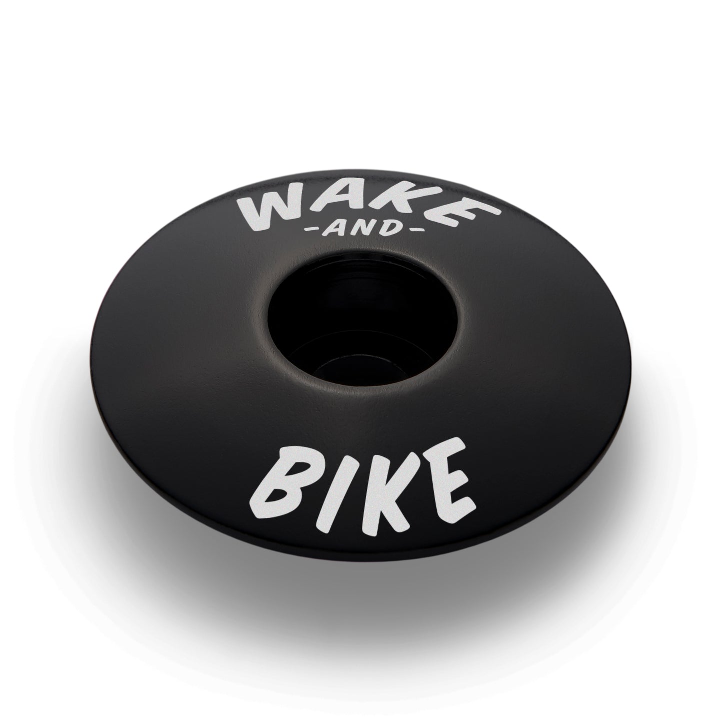 Black bicycle headset cap made of durable aluminum for reliable functionality and stylish design.