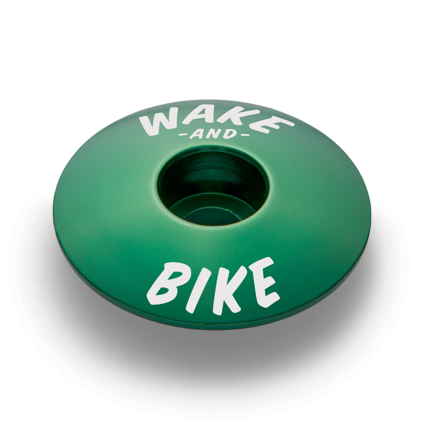 Dark green custom stem cap made from strong aluminum to fit various bike models.