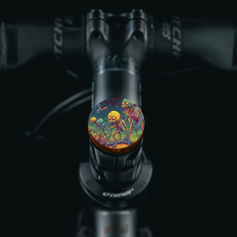 Burnt orange bike headset top cover with vibrant alien-themed artwork for cyclists.