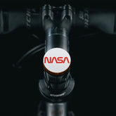 Brown Shapeshifter headset cap displaying the NASA worm logo