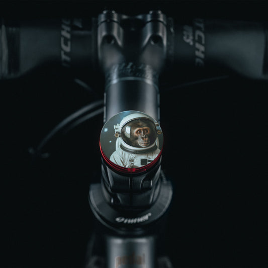 Bold red bike stem cap crafted from precision-machined aluminum.