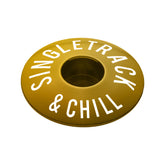 Gold bike headset cap crafted from lightweight aluminum for 1 1/8" steerer tubes.