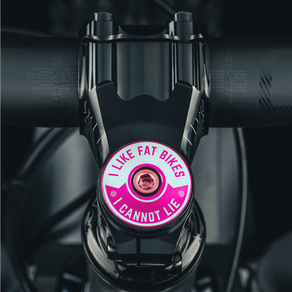 Hot pink bicycle headset cap with "I Like Fat Bikes" design lightweight and durable.