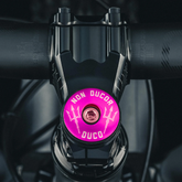 Non Ducor, Duco Custom Bicycle Headset Cap -  Hot pink custom bicycle accessory with "No Bad Rides" text for a unique look.