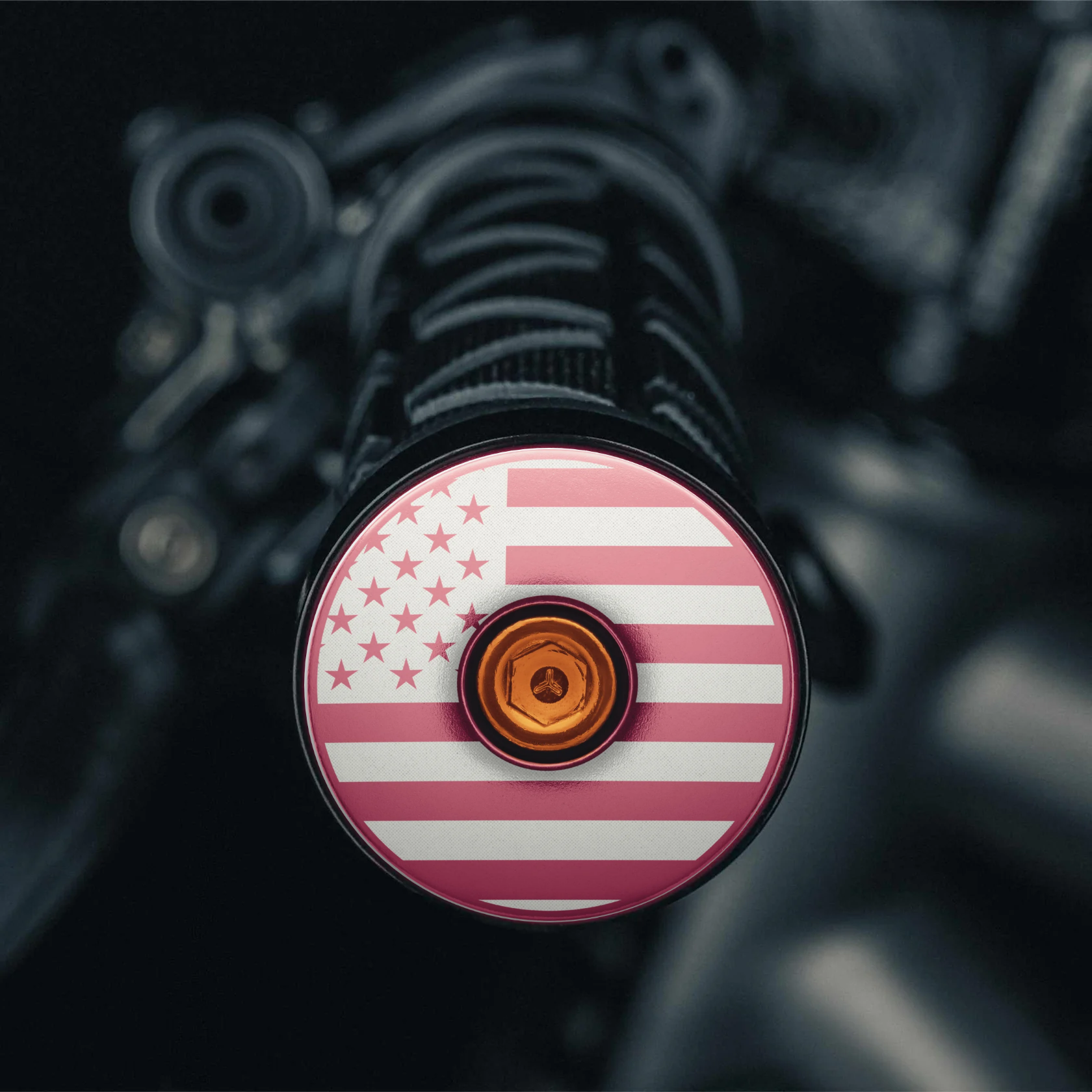 Pink bar end plugs road bike accessory with American flag design.