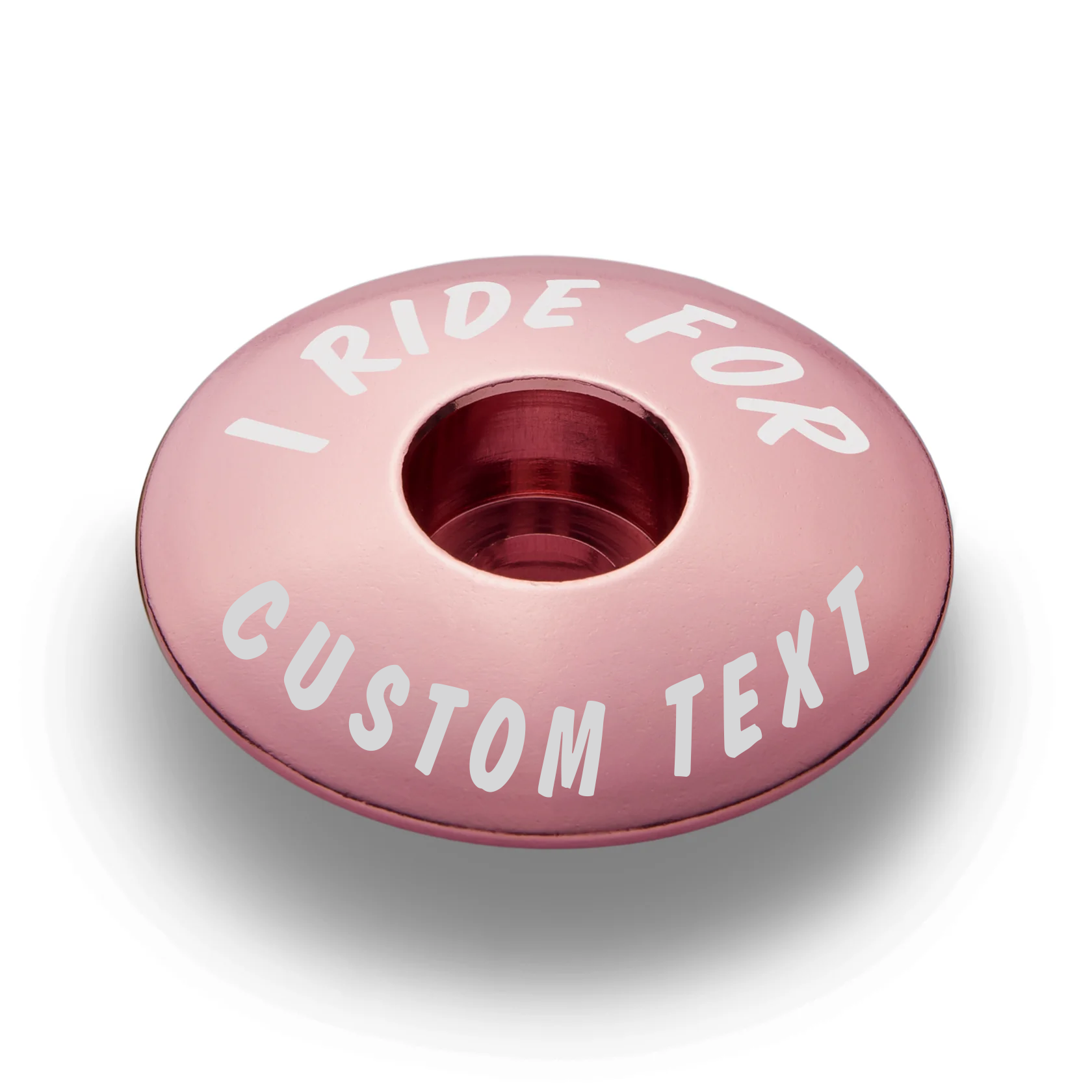 Pink stem top cap offering a colorful and personalized bike accessory