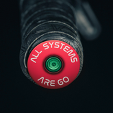 Red bar end plugs mountain bike upgrade for secure and stylish handlebar coverage.