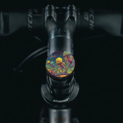 Flat black bicycle headset cap with alien artwork featuring vibrant colors for cycling enthusiasts.