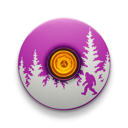 Purple bike headset cap featuring a Bigfoot engraving perfect for cycling top caps.