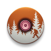 Brown stem cap with Bigfoot engraving ideal for custom bicycle accessories and bike equipment.