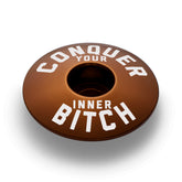 Elegant brown headset top cap for cyclists who appreciate custom bicycle accessories with subtle tones.