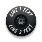 Black bike headset cap made of durable aluminum designed for custom bicycle accessories.