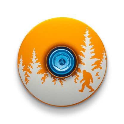 Orange headset top cap with Bigfoot design perfect for customizing your bike stem.