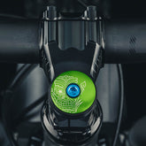 Tiki Trails Bicycle Headset Cap with a tiki-inspired design for 1 1/8-inch steerer tubes made of lightweight aluminum.