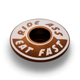 Brown Ride Ass Eat Fast bike headset cap for 1 1/8 steerer tubes adds personality to your bicycle top cap.