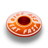 Orange Ride Ass Eat Fast bike headset cap for 1 1/8 steerer tubes adds personality to your bicycle top cap.