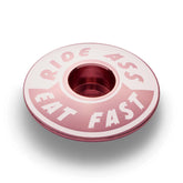 Pink Ride Ass Eat Fast bike headset cap for 1 1/8 steerer tubes adds personality to your bicycle top cap.