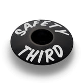 Black bicycle headset cap for 1 1/8" steerer tubes perfect for custom bike components.