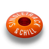 Orange bike top cap with strong aluminum design for 1 1/8" steerer tubes.