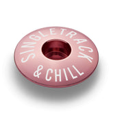 Pink bike stem cap made from durable aluminum fits 1 1/8" steerer tubes.