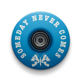 Blue bicycle headset cap with a death moth design for mountain bike customization.