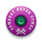 Purple bicycle headset cap with a death moth design for mountain bike customization.