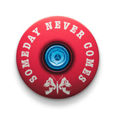 Red bicycle headset cap with a death moth design for mountain bike customization.