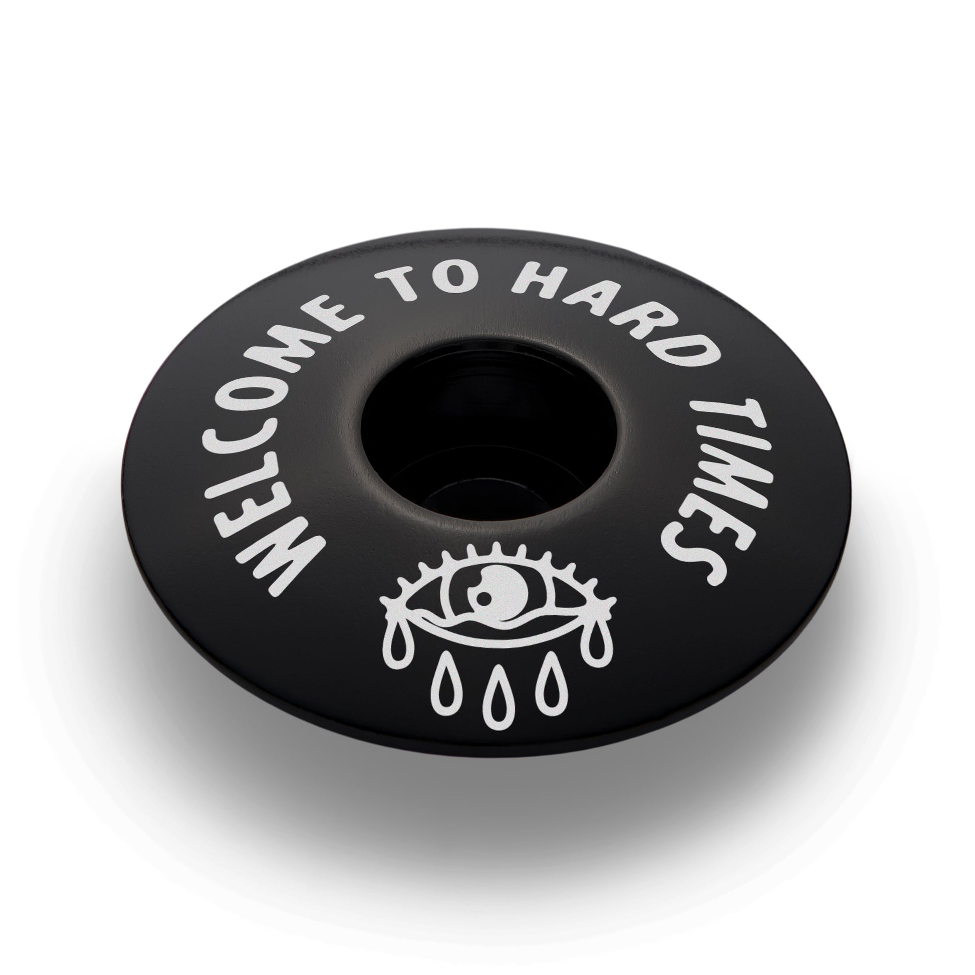 Black bicycle headset cap designed for 1 1/8" steerer tubes and custom fit for bike components.